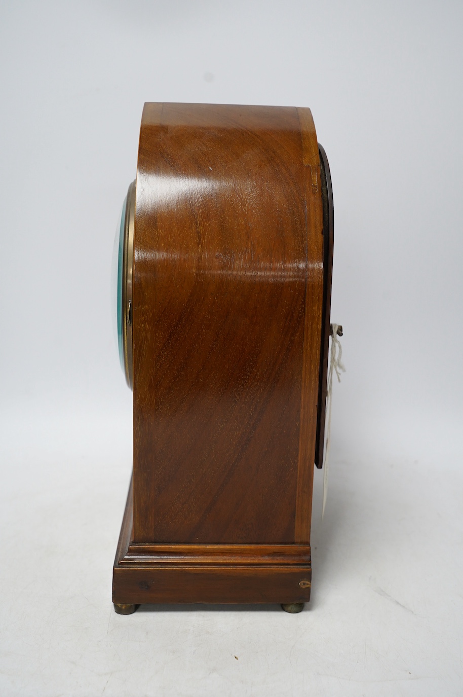 An Edwardian inlaid mahogany eight day lancet topped mantel clock, with key, 31cm high. Condition - fair, untested